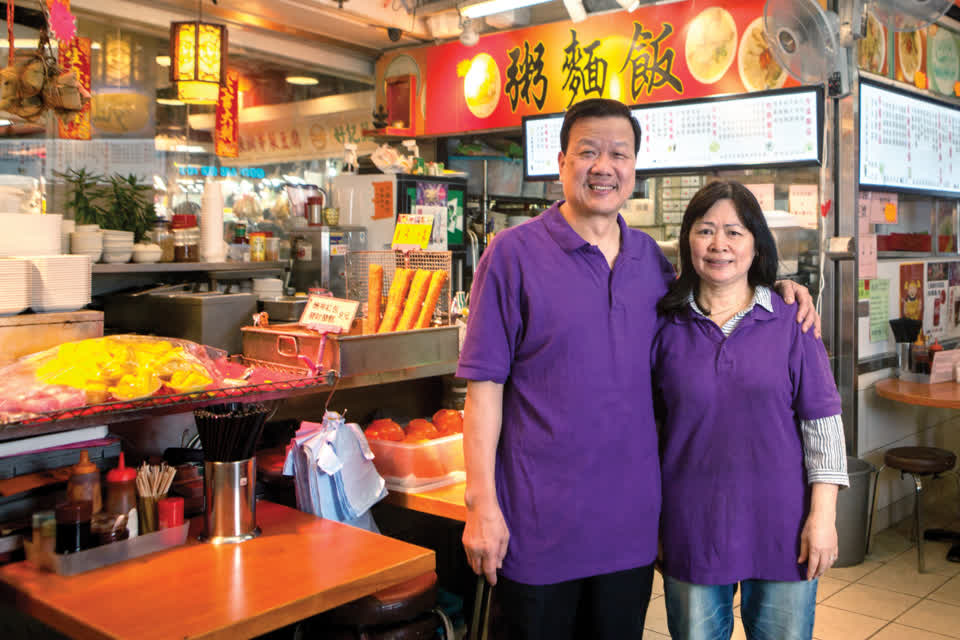 Cooked food stall tenant 朱鎮波 serves up hot food at Link REIT Tai Yuen Market.