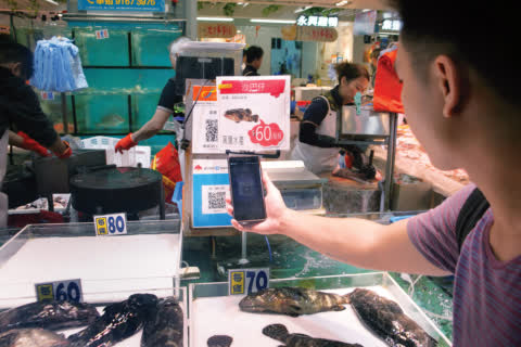 Electronic payment options attract younger shoppers to Link REIT fresh markets. Electronic payment options attract younger shoppers to Link REIT fresh markets.